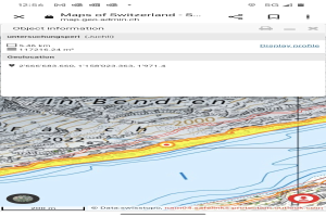 Topografische Karte der Schweiz auf einem Mobilbildschirm mit begleitendem Text und Symbolen angezeigt.