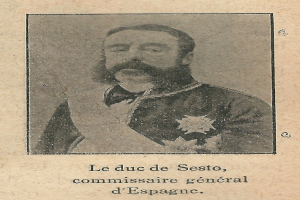 Ein altes Foto eines bärtigen Mannes in Anzug und Krawatte, mit ernster Miene, der in die Ferne schaut.