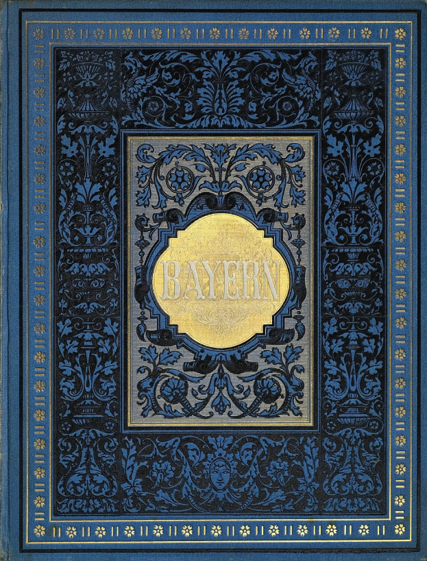 Ein blau-goldenes Buch mit dem Wort "Bayern" auf dem Cover, das mit kunstvollen Verzierungen geschmückt ist.