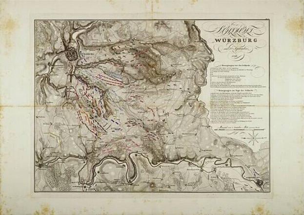 Ausführliche alte Karte von Würzburg, Deutschland, die Straßen, Gebäude und Sehenswürdigkeiten zeigt, begleitet von Text zu Bevölkerung, Straßen und bemerkenswerten Merkmalen.