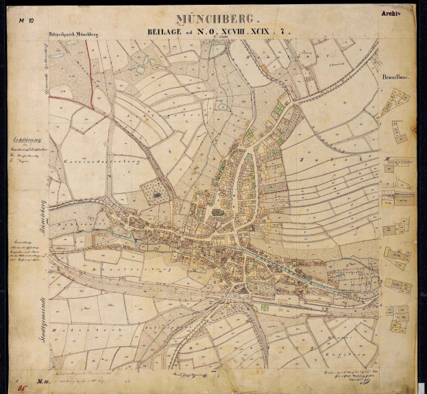 Ein gerahmtes, detailliertes altes Stadtplan von München, Deutschland, der Straßen, Gebäude und Sehenswürdigkeiten zeigt.